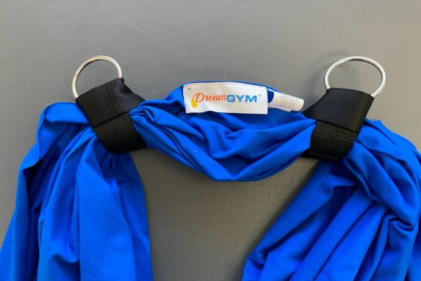 Two secured straps attached to the sensory swing fabric, with a visible 10 to 12 inches of space between them for proper setup.