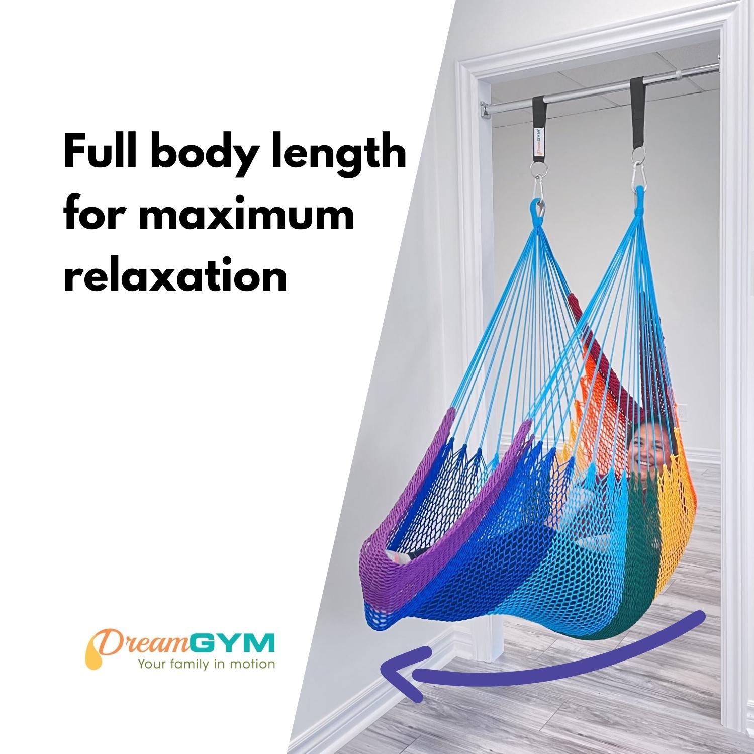 A woman is lounging in doorway hammock swing that provides full body length for maximum relaxation.