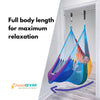 A woman is lounging in doorway hammock swing that provides full body length for maximum relaxation.