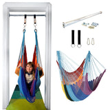 a girl is using a hammock swing installed in a doorway. THe net swing is in bright rainbow colours. 