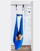 a boy is relaxing in a doorway sensory swing