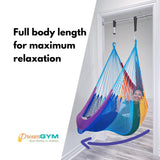 A woman is lounging in doorway hammock swing that provides full body length for maximum relaxation. 