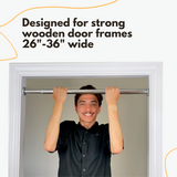DreamGYM Doorway bar desogned for strong wooden door frames 26-36 inches wide. Young adult is doing pull-ups on screw-in chin-up bar