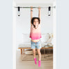 A happy girl is using Doorway Swing Support Bar with Straps - DreamGYM