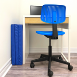 Folded Exercise Mat conviniently hidden behind a desk