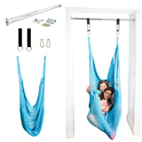 Doorway therapy hammock swing installed in a door frame with two girls using it. 