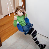A girl is using a classic doorway swing.