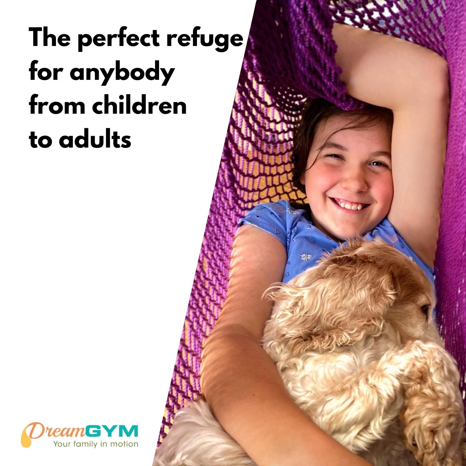 A girl is in hammock swing with her puppy. Hammock swing is the perfect refuge for anybody from children to adults.